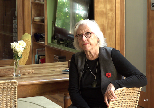 Photo of Dame Gaylene Preston sitting in a house.